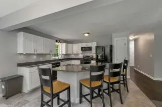 Inviting Cul-de-Sac Home with Granite Kitchen and Farmer’s Porch