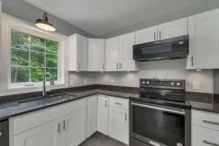 Inviting Cul-de-Sac Home with Granite Kitchen and Farmer’s Porch