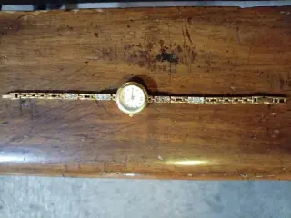 RELOJ AVON BANADO EN ORO BUEN ESTADO