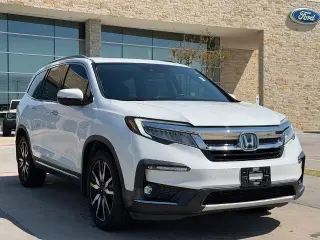 Honda Pilot 2021 Touring SUV 4 puertas con asientos traseros tipo capitán