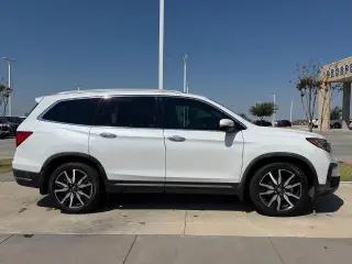 Honda Pilot 2021 Touring SUV 4 puertas con asientos traseros tipo capitán