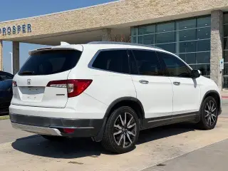 Honda Pilot 2021 Touring SUV 4 puertas con asientos traseros tipo capitán