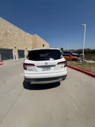 Honda Pilot 2021 Touring SUV 4 puertas con asientos traseros tipo capitán