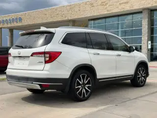 Honda Pilot 2019 Touring 4dr SUV con asientos del capitán traseros