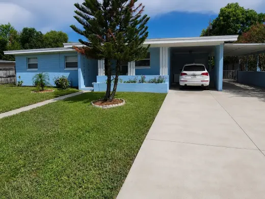 spacious lawn surrounded by a privacy fence
