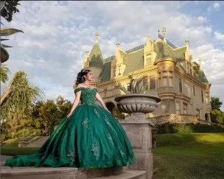 golden fox photo -quinceanera green dress in front of castle