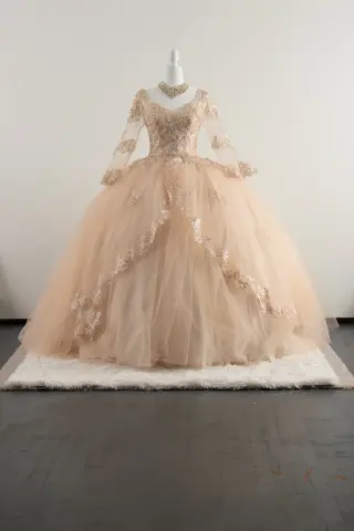 Long-sleeve peach/cream quinceañera dress with lace appliqués, sweetheart neckline, and voluminous ball gown skirt -1