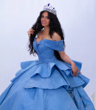 A custom blue quinceañera dress with off-the-shoulder neckline, sweetheart bodice, and ruffled ball gown skirt with a flowing train - 5