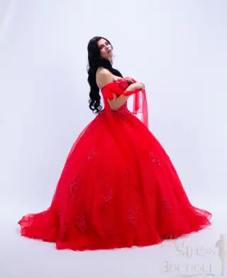A red Barbieland quinceañera dress with off-the-shoulder neckline, sheer puff sleeves, beaded bodice, and voluminous sparkling ball gown skirt -4